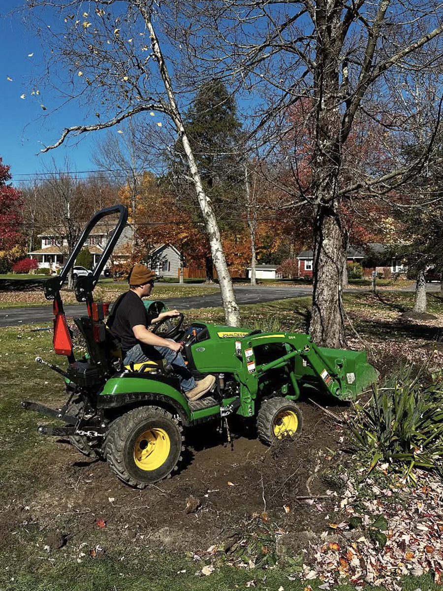 Stonewood employee on a tractor